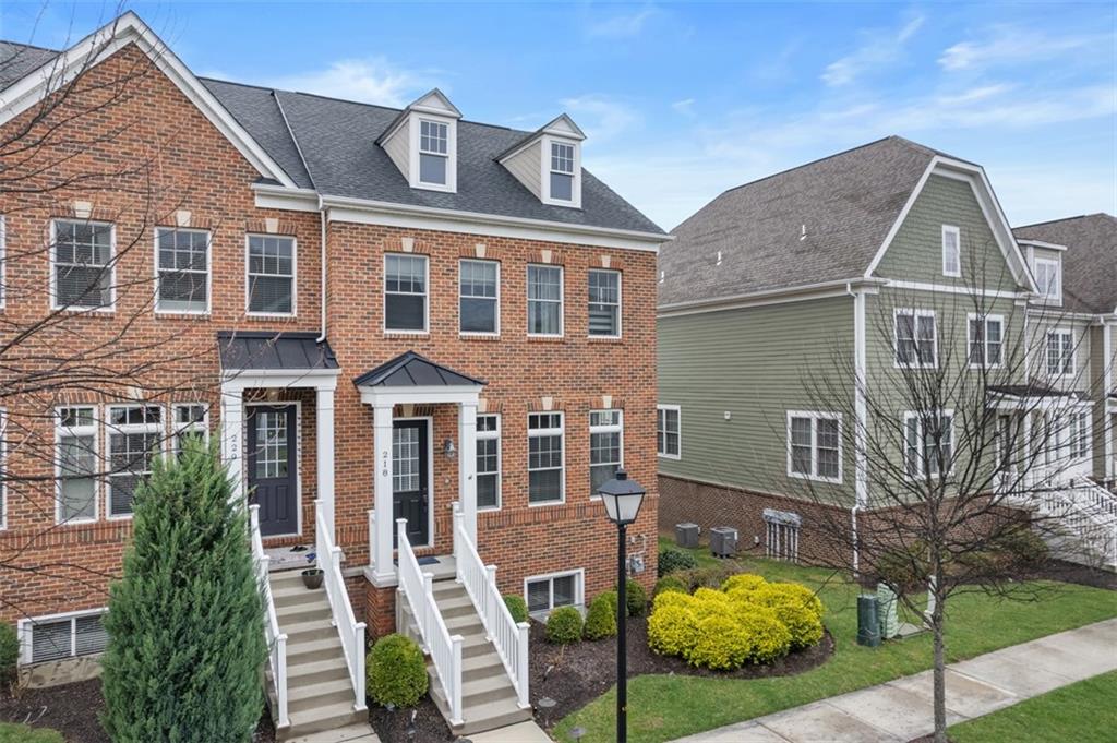 218 Venango Trail Mars, PA 16046 - Photo 2 of 42 a front view of a house with garden