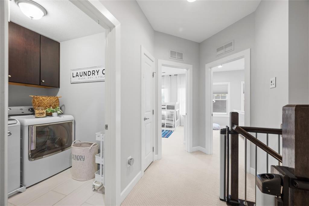 218 Venango Trail Mars, PA 16046 - Photo 26 of 42 a view of a hallway with washer and dryer