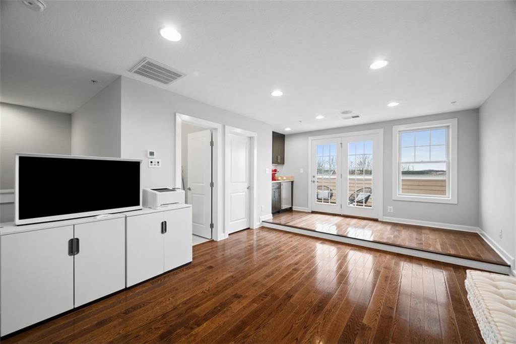 218 Venango Trail Mars, PA 16046 - Photo 28 of 42 a view of a livingroom with wooden floor and a flat screen tv