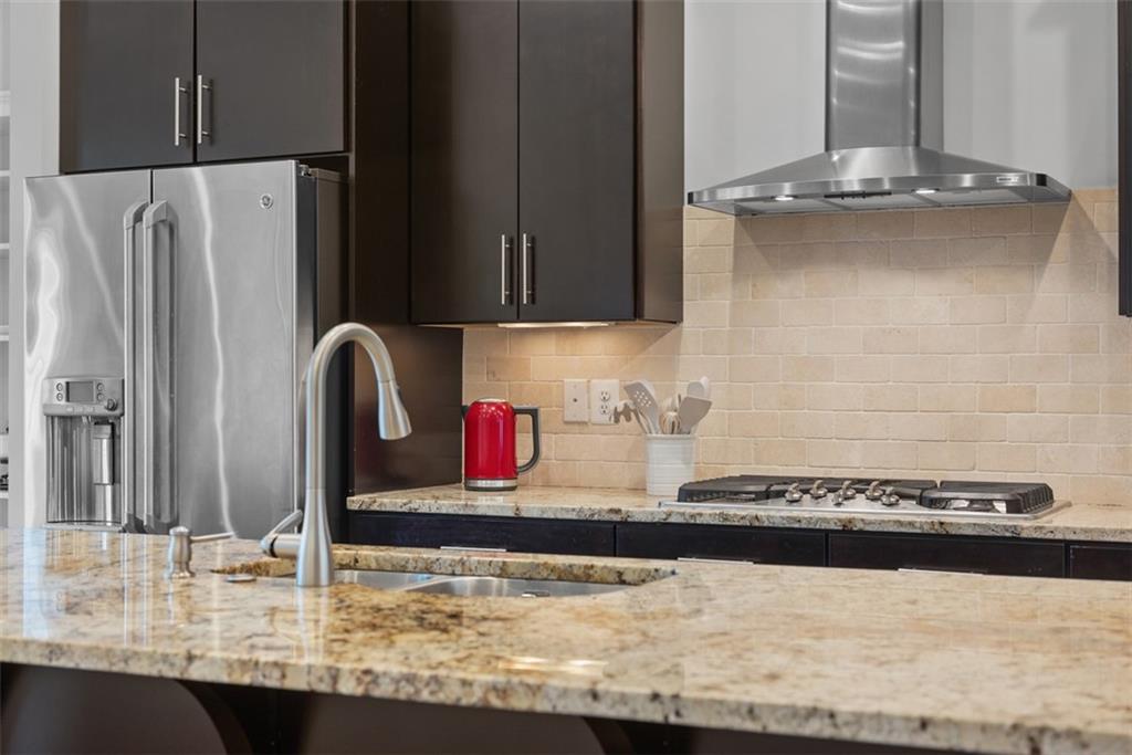 218 Venango Trail Mars, PA 16046 - Photo 8 of 42 a kitchen with granite countertop a refrigerator and a stove top oven