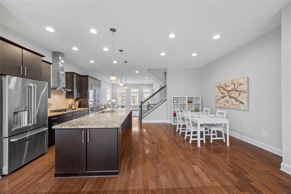 218 Venango Trail Mars, PA 16046 - Photo 9 of 42 a kitchen with stainless steel appliances granite countertop a refrigerator a stove and a wooden floors