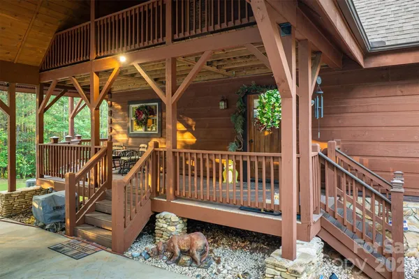 a view of a wooden deck with a chairs