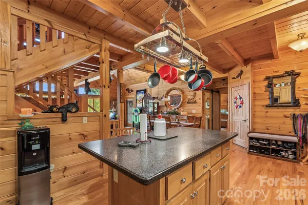 a kitchen with stainless steel appliances granite countertop a sink and cabinets