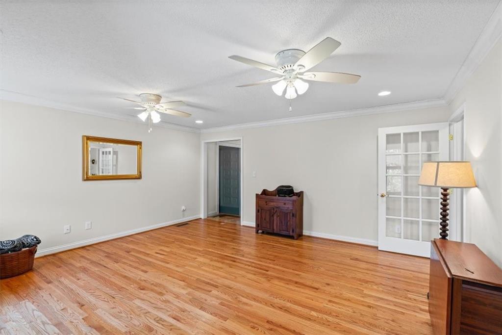 11 Paige Street Cartersville, GA 30121 - Photo 12 of 49 a view of empty room with wooden floor and fan