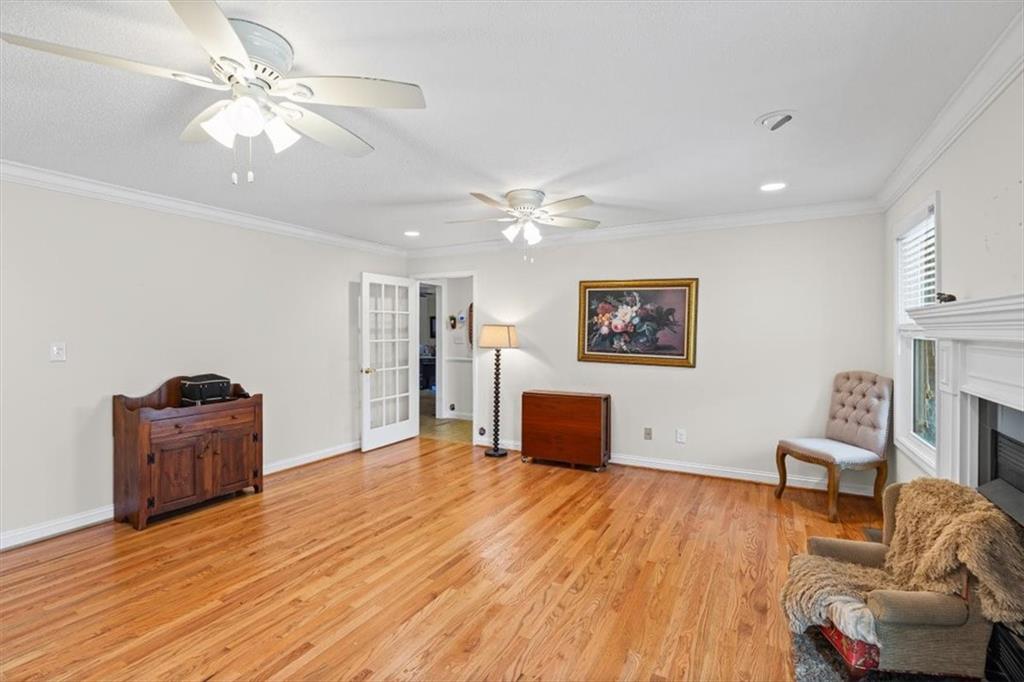 11 Paige Street Cartersville, GA 30121 - Photo 13 of 49 a view of a livingroom with furniture a flat screen tv and wooden floor
