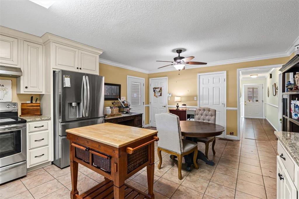 11 Paige Street Cartersville, GA 30121 - Photo 16 of 49 a view of a dining room with furniture and a chandelier