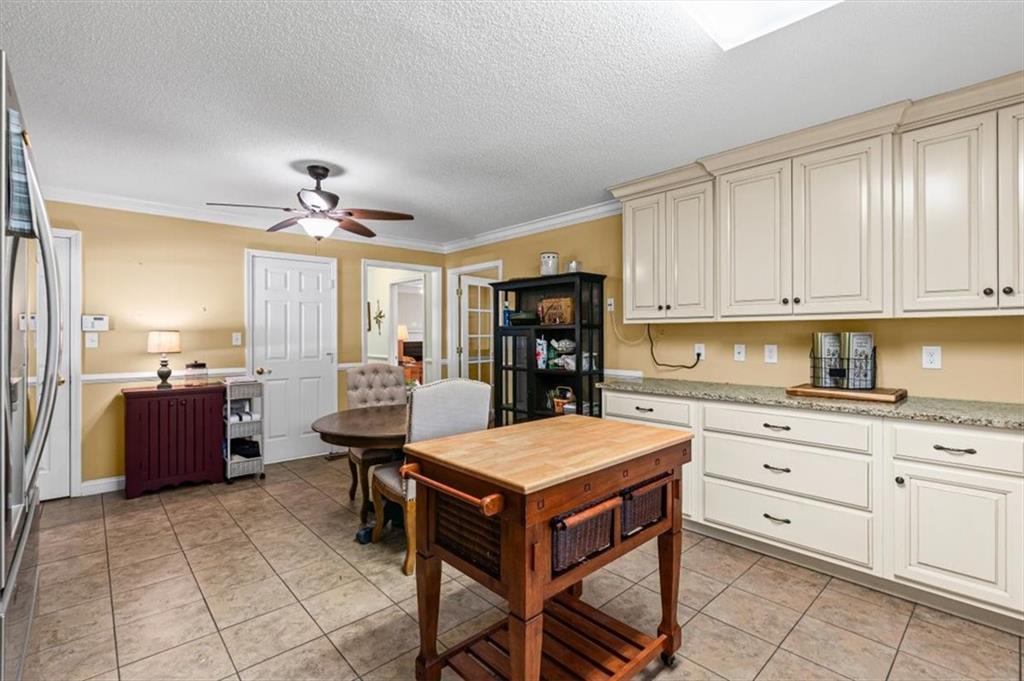 11 Paige Street Cartersville, GA 30121 - Photo 19 of 49 a kitchen with a refrigerator and cabinets