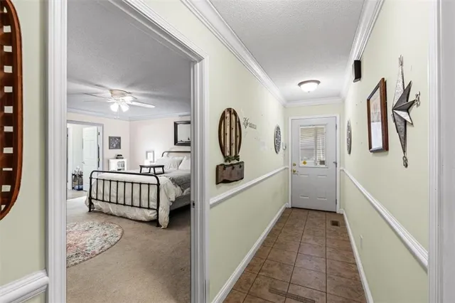 a hallway with a large walk in closet and wooden floor