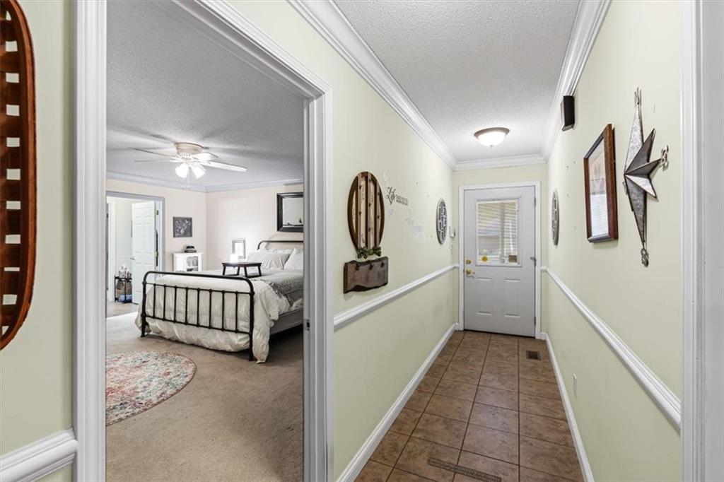 11 Paige Street Cartersville, GA 30121 - Photo 25 of 49 a hallway with a large walk in closet and wooden floor