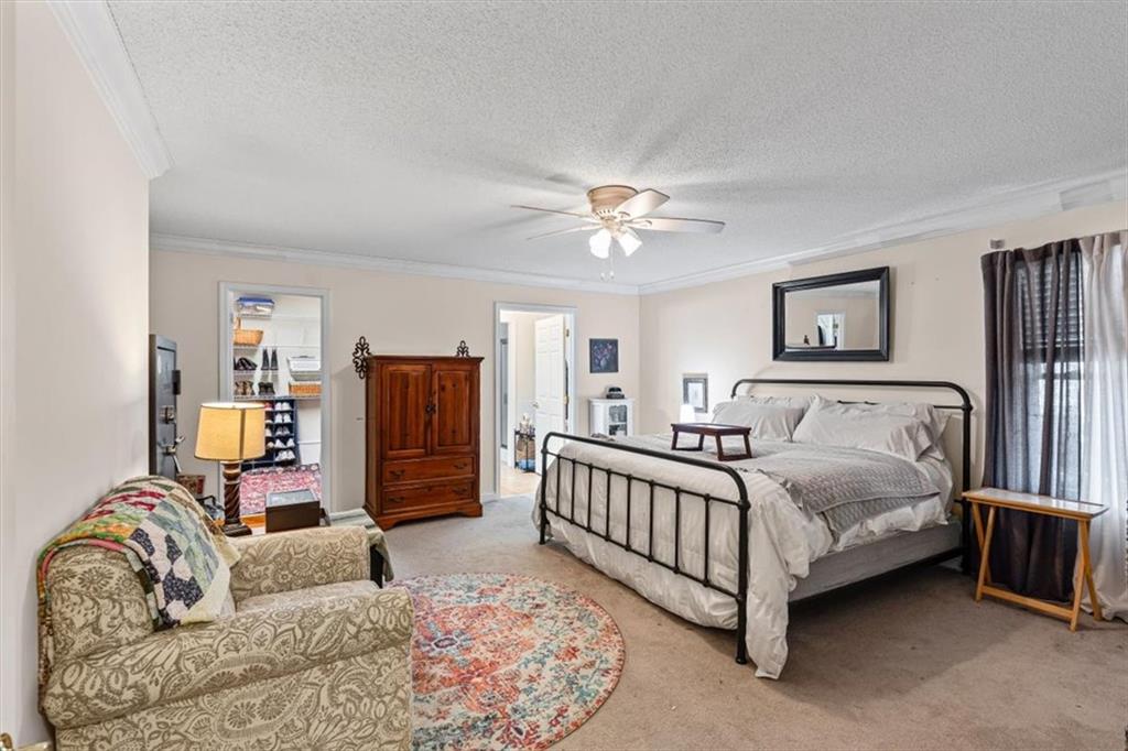 11 Paige Street Cartersville, GA 30121 - Photo 26 of 49 a bedroom with furniture and a couch