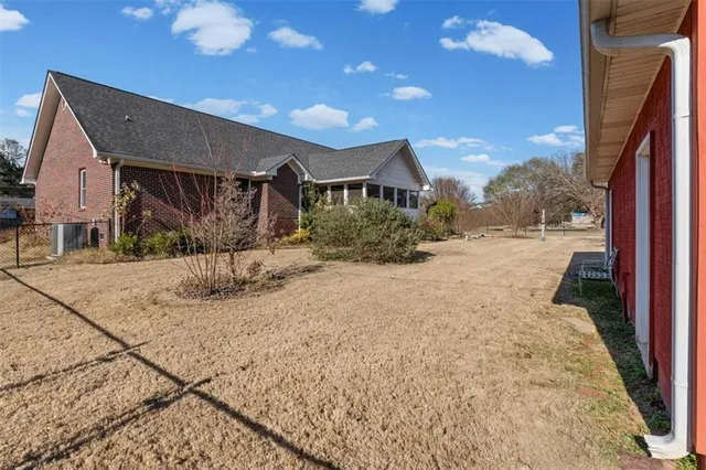 a view of a house with a snow in the yard