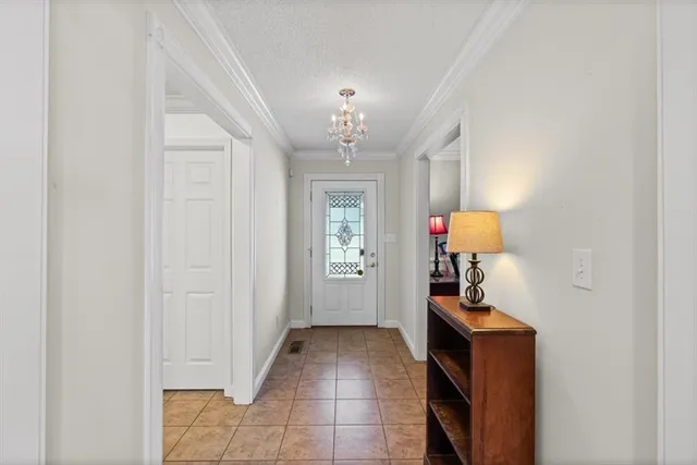 a view of an entryway with kitchen