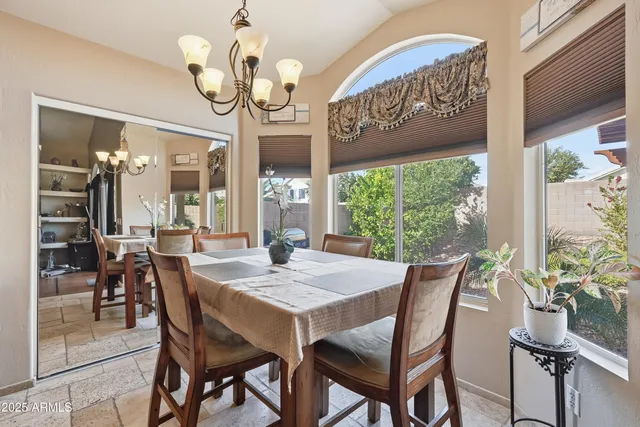 a view of a dining room with furniture window and outside view