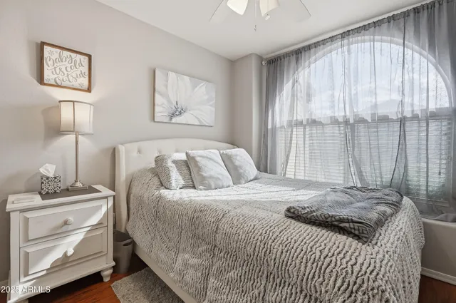 a bedroom with a bed and a window