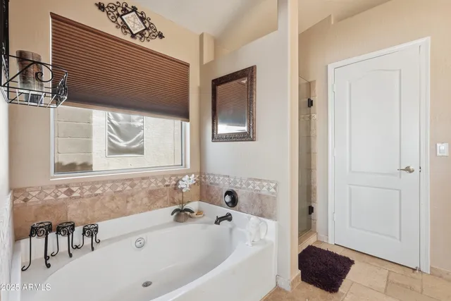 a bathroom with a tub and a sink