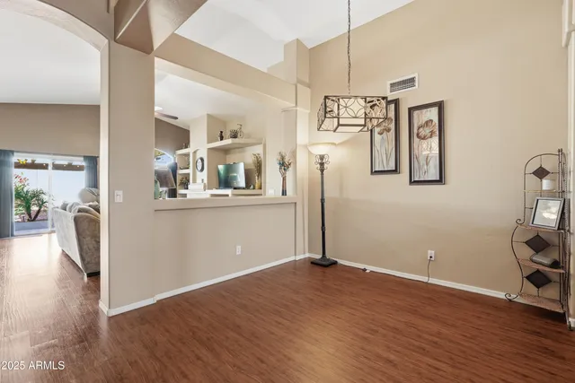 a view of a kitchen with wooden floor