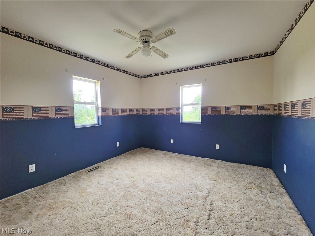 63 Old Ashby Ridge Road Parkersburg, WV 26104 - Photo 5 of 13 Carpeted empty room featuring ceiling fan