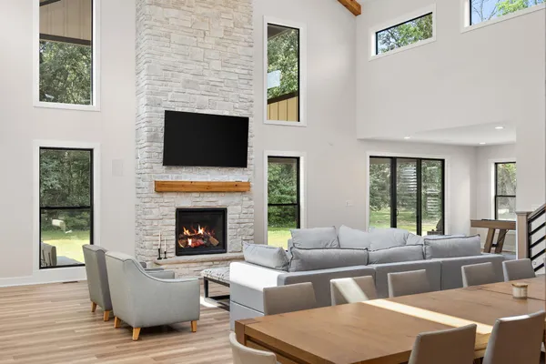 a spacious bedroom with a bed and a flat screen tv