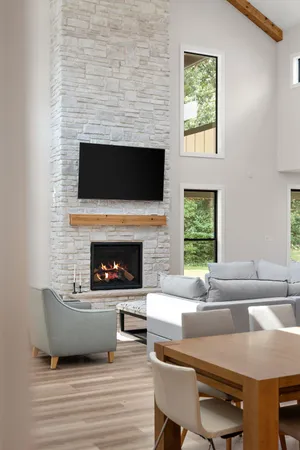 a bed sitting in a spacious bedroom next to a window