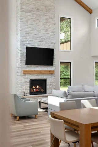 a bed sitting in a spacious bedroom next to a window