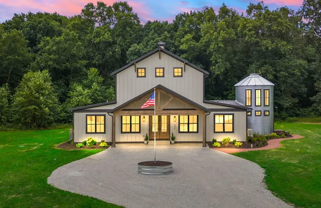 a front view of a house with a yard and porch