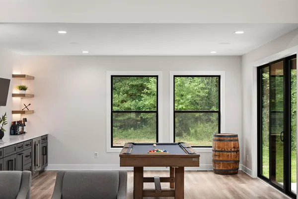 a view of a house with a yard patio and fire pit