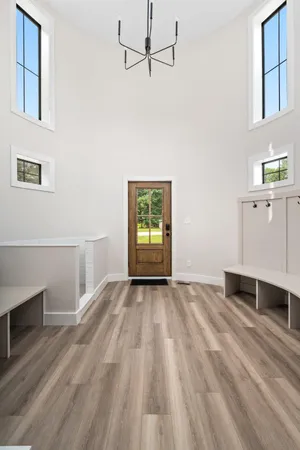 a view of a house with a large tree