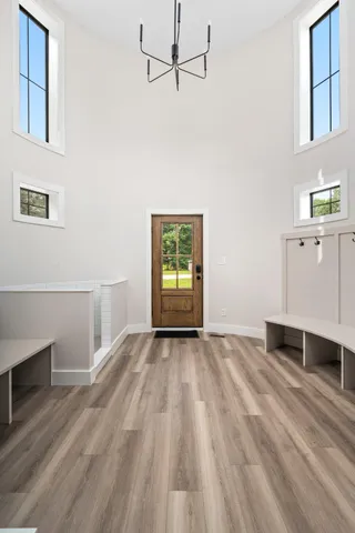 a view of a house with a large tree