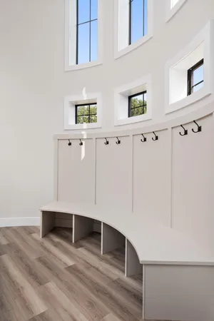 a bed room with a bed and a ceiling fan