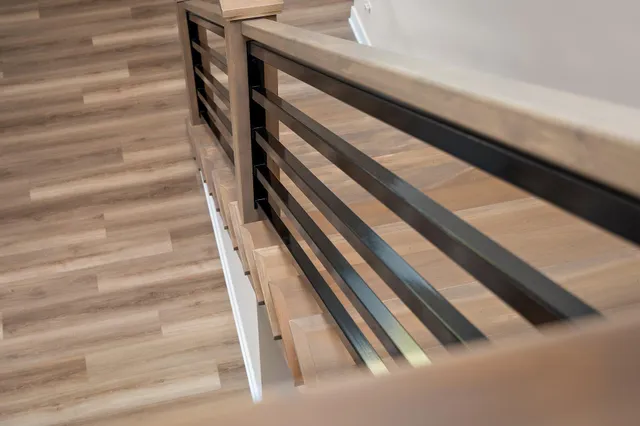 a spacious bathroom with a double vanity sink toilet and a mirror