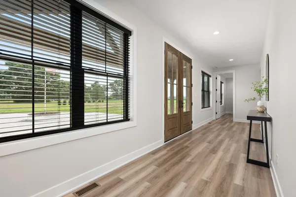 a living room with furniture fireplace and window