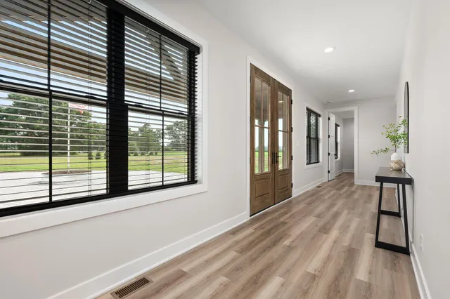 a living room with furniture fireplace and window