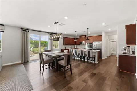a kitchen with a table and chairs in it