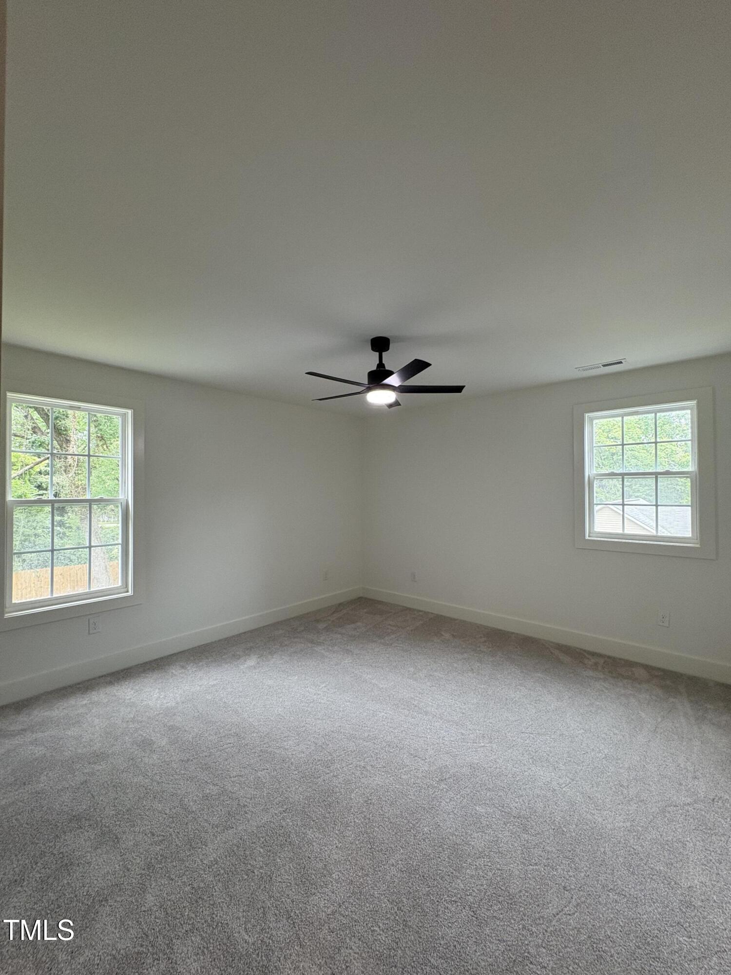 4511 Denfield Street Durham, NC 27704 - Photo 23 of 40 an empty room with a window