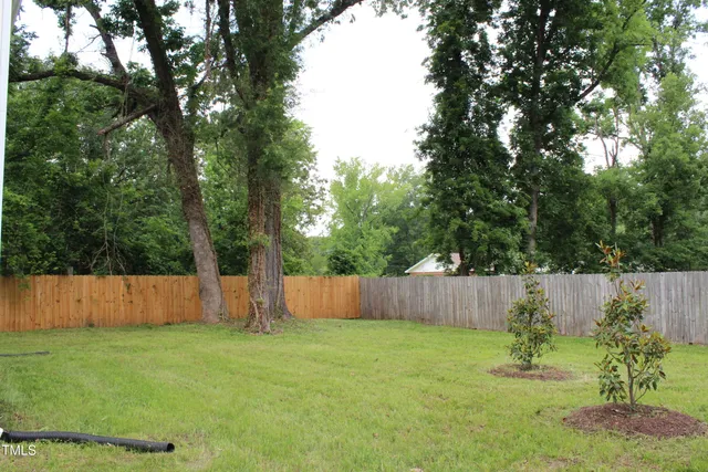 a backyard of a house with lots of green space
