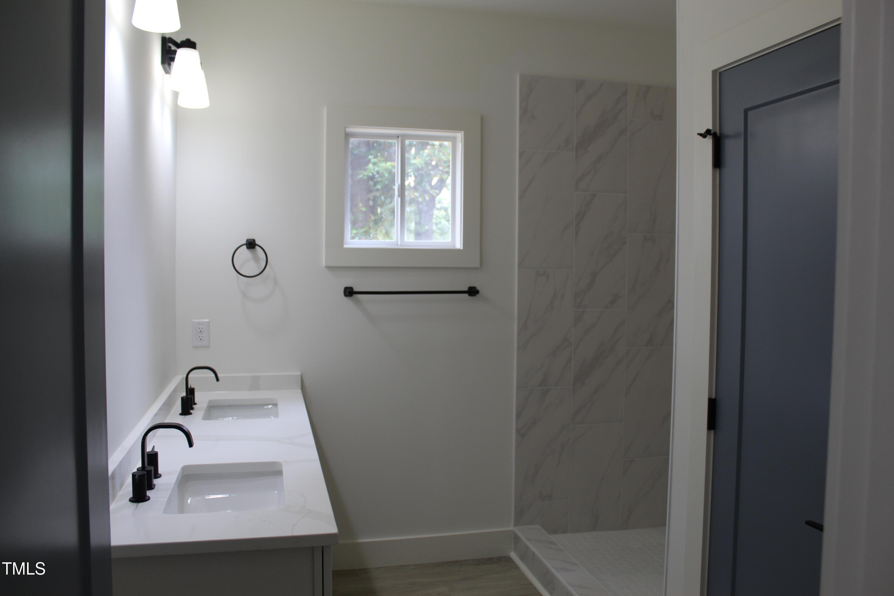 4511 Denfield Street Durham, NC 27704 - Photo 10 of 40 a bathroom with a sink and a mirror
