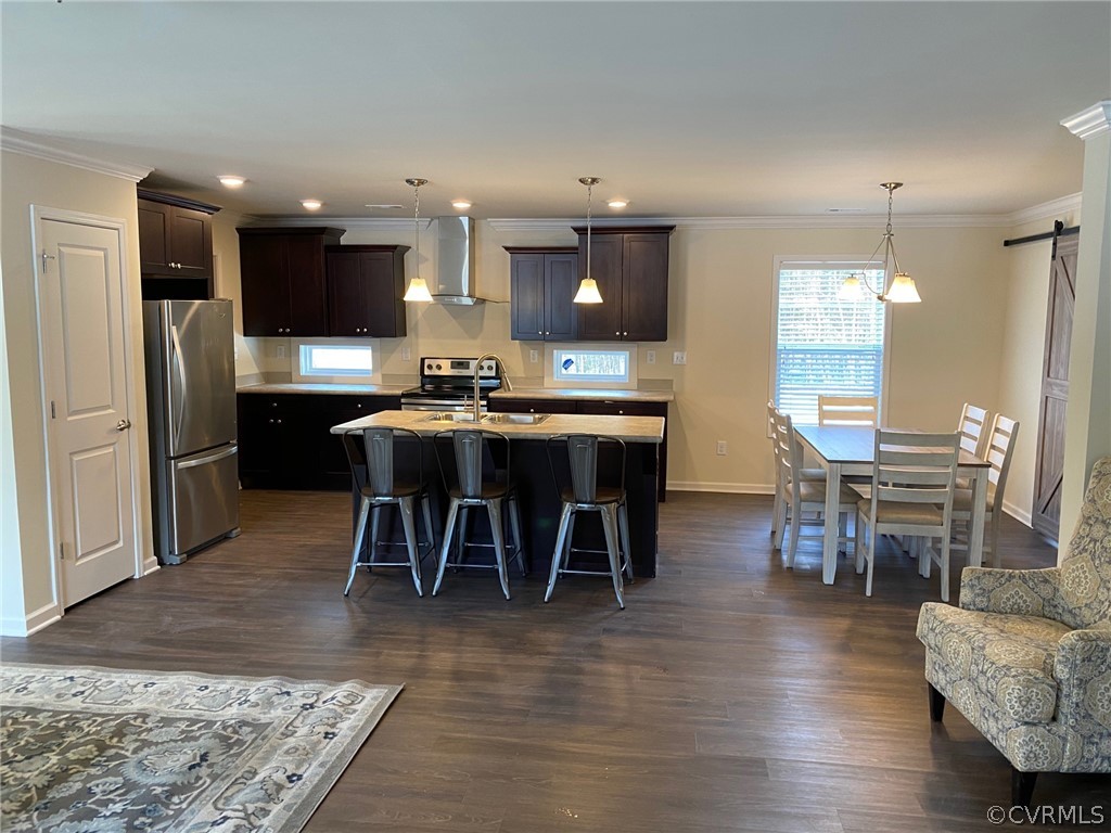 1029 Jackson Road Bumpass, VA 23024 - Photo 12 of 21 a kitchen with stainless steel appliances kitchen island granite countertop a table chairs sink and cabinets