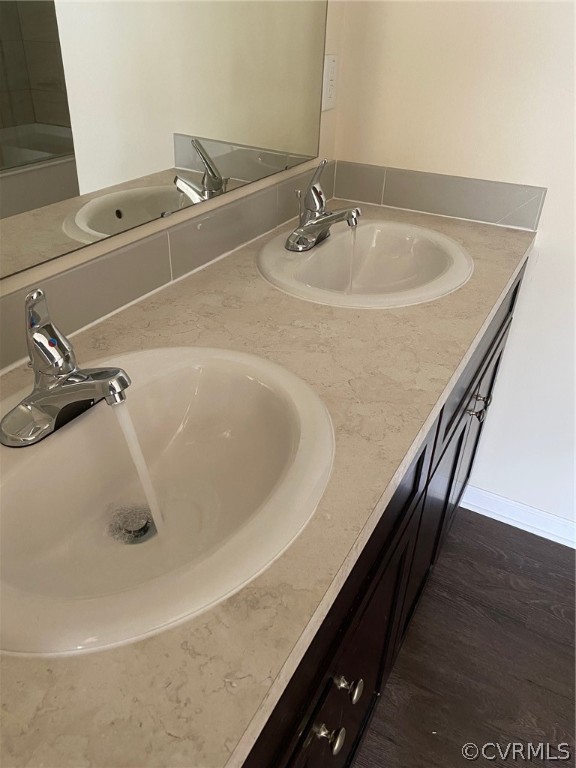1029 Jackson Road Bumpass, VA 23024 - Photo 18 of 21 a bathroom with a sink and a mirror
