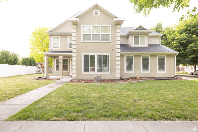 293 North 550 West Springville, UT 84663 - Photo 2 of 33 Two-story stucco residence featuring a covered front entry and multiple large windows