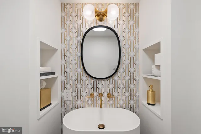 a bathroom with a sink and mirror