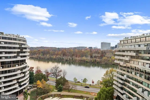 a view of a lake with building in front of it