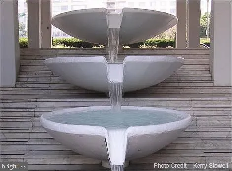 a view of a building with sitting area