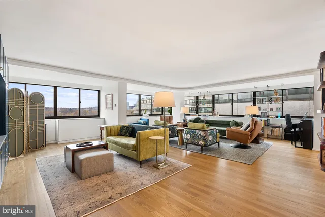 a living room with furniture or couch and a wooden floor