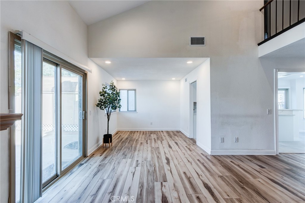 11721 Mt Sterling Court Rancho Cucamonga, CA 91737 - Photo 12 of 38 wooden floor in an empty room with a window