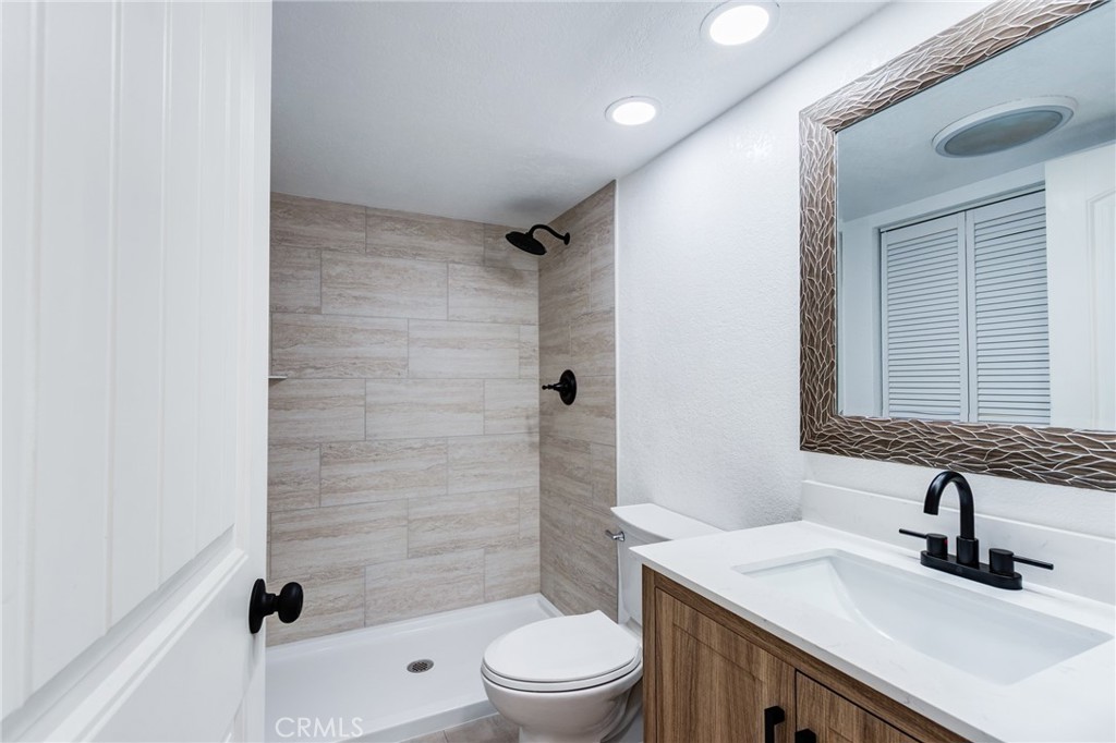 11721 Mt Sterling Court Rancho Cucamonga, CA 91737 - Photo 13 of 38 a bathroom with a sink a toilet and shower