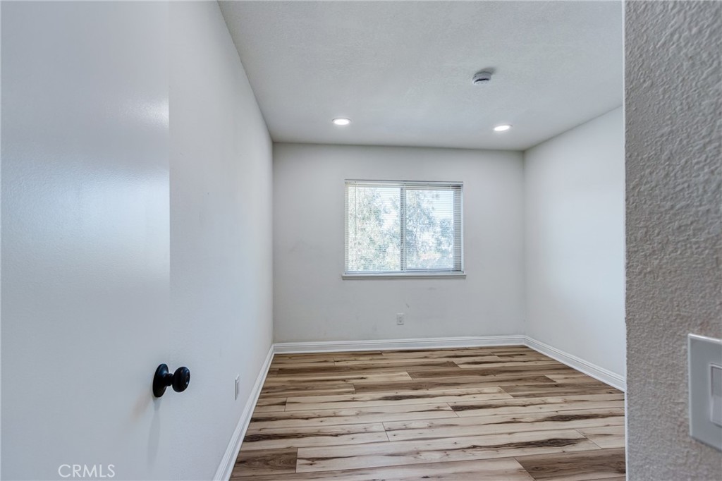 11721 Mt Sterling Court Rancho Cucamonga, CA 91737 - Photo 18 of 38 a view of wooden floor and windows in a room