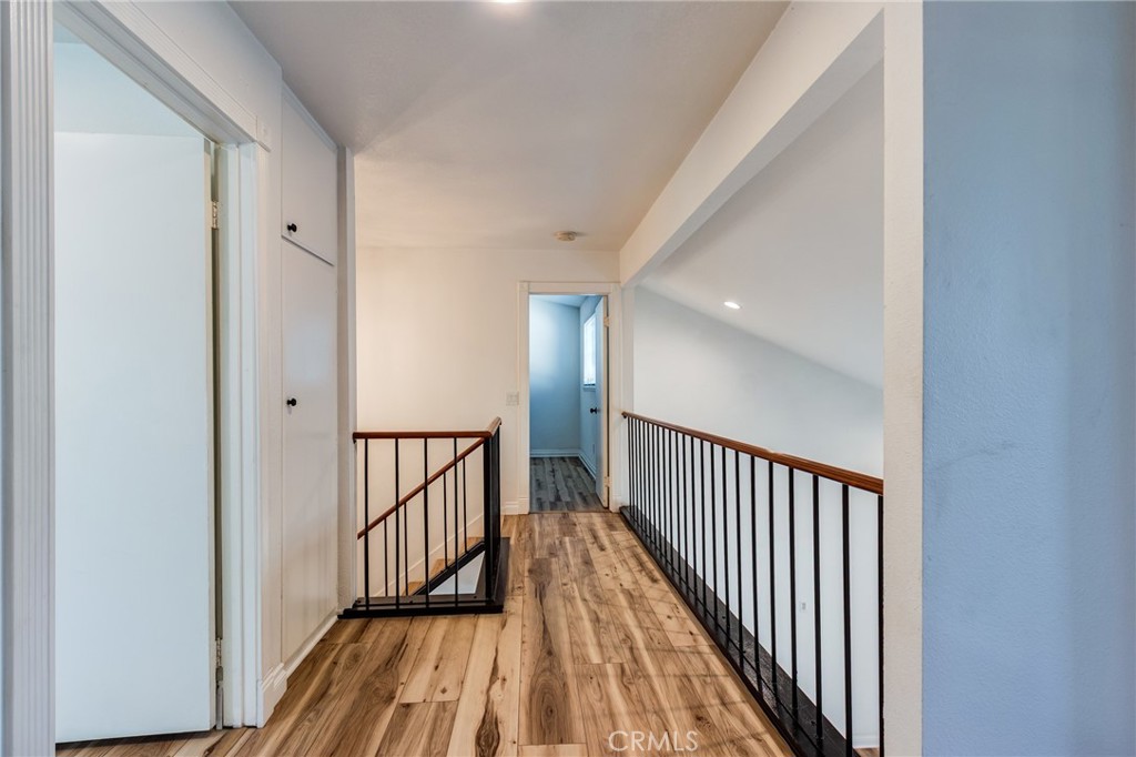 11721 Mt Sterling Court Rancho Cucamonga, CA 91737 - Photo 22 of 38 a view of hallway with wooden floor