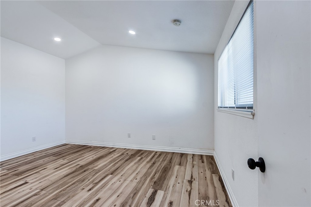 11721 Mt Sterling Court Rancho Cucamonga, CA 91737 - Photo 25 of 38 a view of a room with wooden floor and white walls