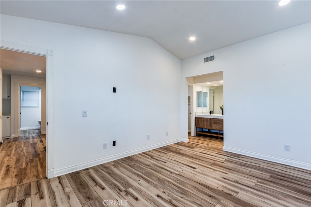 11721 Mt Sterling Court Rancho Cucamonga, CA 91737 - Photo 26 of 38 a view of empty room with wooden floor