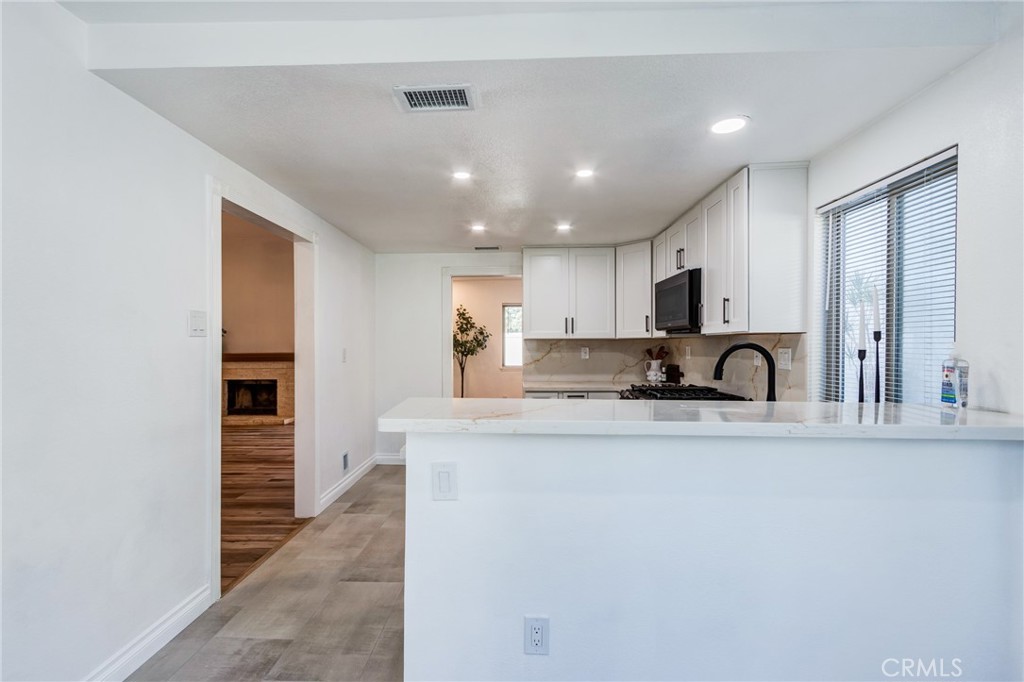 11721 Mt Sterling Court Rancho Cucamonga, CA 91737 - Photo 7 of 38 a kitchen with stainless steel appliances granite countertop a sink and cabinets
